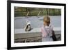 Boy Standing with Kitten in Schoolyard-William P. Gottlieb-Framed Photographic Print