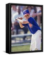 Boy Swinging a Baseball Bat on a Field-null-Framed Stretched Canvas