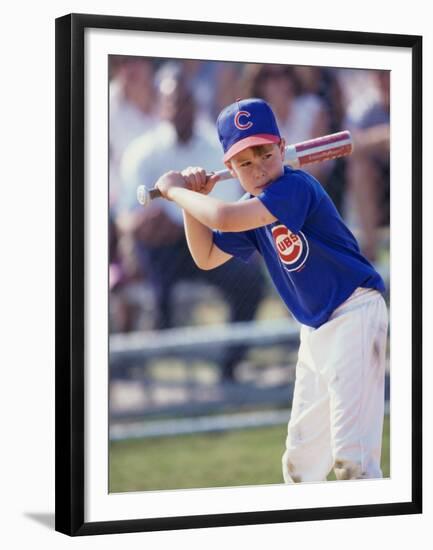 Boy Swinging a Baseball Bat on a Field-null-Framed Premium Photographic Print