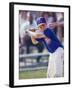 Boy Swinging a Baseball Bat on a Field-null-Framed Premium Photographic Print