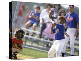 Boy Swinging a Baseball Bat on a Field-null-Stretched Canvas