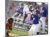 Boy Swinging a Baseball Bat on a Field-null-Mounted Premium Photographic Print