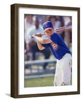 Boy Swinging a Baseball Bat on a Field-null-Framed Photographic Print