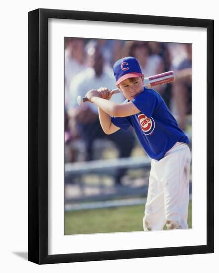 Boy Swinging a Baseball Bat on a Field-null-Framed Photographic Print