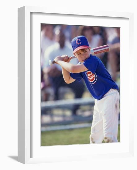 Boy Swinging a Baseball Bat on a Field-null-Framed Photographic Print