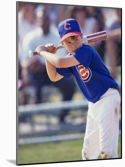 Boy Swinging a Baseball Bat on a Field-null-Mounted Photographic Print