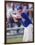 Boy Swinging a Baseball Bat on a Field-null-Framed Photographic Print