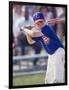 Boy Swinging a Baseball Bat on a Field-null-Framed Photographic Print