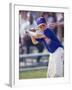 Boy Swinging a Baseball Bat on a Field-null-Framed Photographic Print