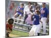 Boy Swinging a Baseball Bat on a Field-null-Mounted Photographic Print