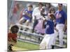 Boy Swinging a Baseball Bat on a Field-null-Mounted Photographic Print