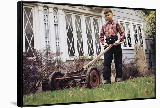 Boy Unhappily Mowing Lawn-William P. Gottlieb-Framed Stretched Canvas