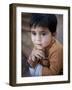 Boy Waits to Receive a Ration of Donated Rice at Food Distribution Center in Islamabad, Pakistan-null-Framed Photographic Print