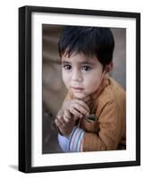 Boy Waits to Receive a Ration of Donated Rice at Food Distribution Center in Islamabad, Pakistan-null-Framed Photographic Print