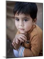 Boy Waits to Receive a Ration of Donated Rice at Food Distribution Center in Islamabad, Pakistan-null-Mounted Photographic Print