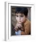 Boy Waits to Receive a Ration of Donated Rice at Food Distribution Center in Islamabad, Pakistan-null-Framed Photographic Print