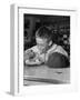 Boy Wearing Baseball Uniform Eating Banana Split at Soda Fountain Counter-Joe Scherschel-Framed Photographic Print