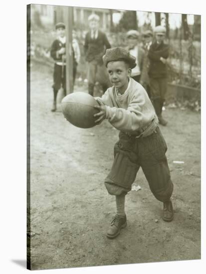 Boy with Football, Early 1900s-Marvin Boland-Stretched Canvas