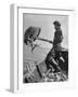 Boy Working Feverishly to Fill His Dory with Fish-null-Framed Photographic Print