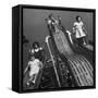 Boys and Girls Play on the Slides at a Playground-null-Framed Stretched Canvas