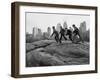 Boys Climbing About on Rock Formation in Central Park as Essex House Looms Amidst Skyline of City-Bill Ray-Framed Photographic Print