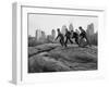 Boys Climbing About on Rock Formation in Central Park as Essex House Looms Amidst Skyline of City-Bill Ray-Framed Photographic Print