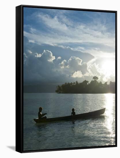 Boys in a Canoe in Backlit in the Marovo Lagoon, Solomon Islands, Pacific-Michael Runkel-Framed Stretched Canvas