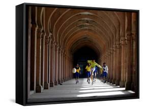 Boys Play Soccer Through an Arched Hallway at the Allahabad University Campus-null-Framed Stretched Canvas