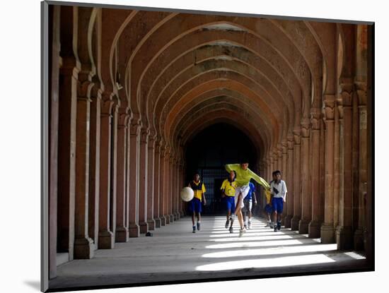 Boys Play Soccer Through an Arched Hallway at the Allahabad University Campus-null-Mounted Photographic Print