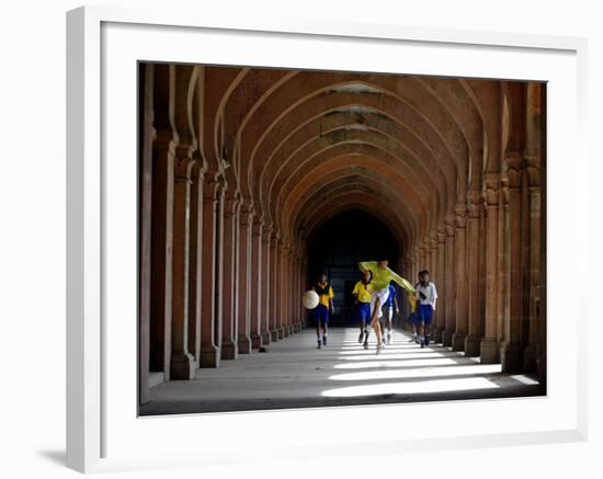 Boys Play Soccer Through an Arched Hallway at the Allahabad University Campus-null-Framed Photographic Print