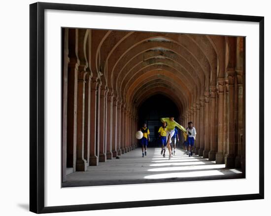 Boys Play Soccer Through an Arched Hallway at the Allahabad University Campus-null-Framed Photographic Print