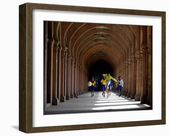 Boys Play Soccer Through an Arched Hallway at the Allahabad University Campus-null-Framed Photographic Print