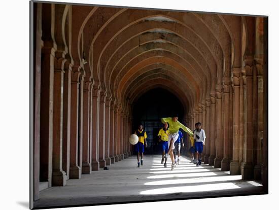 Boys Play Soccer Through an Arched Hallway at the Allahabad University Campus-null-Mounted Photographic Print