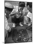 Boys Playing Board Game on Sidewalk in Front of the Trocadero Hotel-Dmitri Kessel-Mounted Photographic Print
