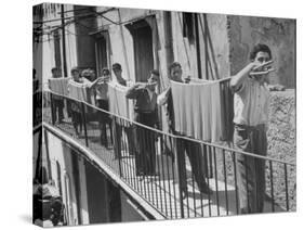 Boys Working in Pasta Factory Carry Rods of Pasta to Drying Rooms-Alfred Eisenstaedt-Stretched Canvas