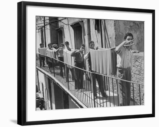 Boys Working in Pasta Factory Carry Rods of Pasta to Drying Rooms-Alfred Eisenstaedt-Framed Photographic Print