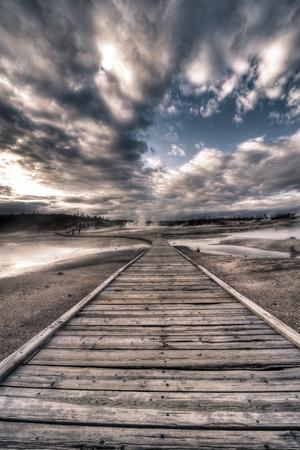 Yellowstone, Wyoming: a Wooden Path Going Through Norris Geyser Basin on a Cloudy Sunset