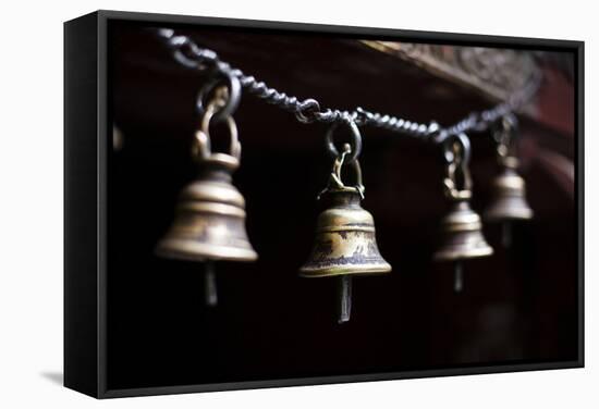 Brass Bells Hang at the Entryway to a Temple in Kathmandu, Nepal-Sergio Ballivian-Framed Stretched Canvas