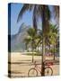 Brazil, Rio De Janeiro, Leblon Beach, Bike Leaning on Palm Tree-Jane Sweeney-Stretched Canvas