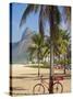 Brazil, Rio De Janeiro, Leblon Beach, Bike Leaning on Palm Tree-Jane Sweeney-Stretched Canvas