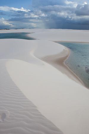 https://imgc.allpostersimages.com/img/posters/brazil-s-lencois-maranhenses-sand-dunes-and-lagoons-on-a-stormy-afternoon_u-L-PSVY9E0.jpg?artPerspective=n