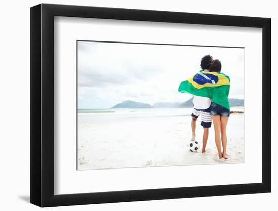 Brazil Soccer Fans Stand on Beach Together with Flag for World Cup with Ball-warrengoldswain-Framed Photographic Print