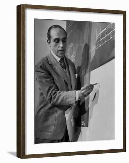 Brazilian Architect Oscar Niemeyer Discussing Design for the United Nations Headquarters Buildings-null-Framed Premium Photographic Print