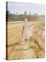 Brazilian Woman Walking Down a Sandy Road Carrying a Large Jar on Her Head-Dmitri Kessel-Stretched Canvas