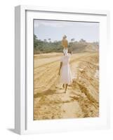 Brazilian Woman Walking Down a Sandy Road Carrying a Large Jar on Her Head-Dmitri Kessel-Framed Photographic Print