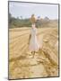 Brazilian Woman Walking Down a Sandy Road Carrying a Large Jar on Her Head-Dmitri Kessel-Mounted Photographic Print