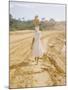 Brazilian Woman Walking Down a Sandy Road Carrying a Large Jar on Her Head-Dmitri Kessel-Mounted Photographic Print