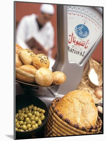 Bread, Rolls and Olives in a Moroccan Shop-Jean Cazals-Mounted Photographic Print