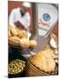 Bread, Rolls and Olives in a Moroccan Shop-Jean Cazals-Mounted Photographic Print
