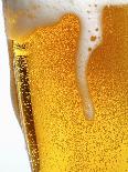 Foam Pouring over Edge of Glass of Light Beer-Brenda Spaude-Mounted Photographic Print